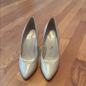Beige high heel pumps